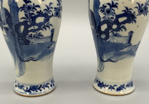 fig 6. A pair of flared Chinese blue and white porcelain vases hand painted with figural court ladies amidst floral motifs.