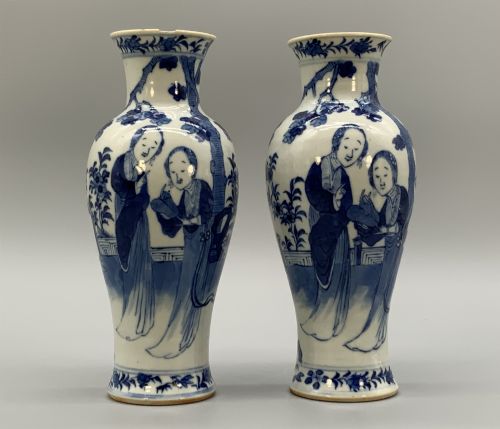 fig 7. A pair of flared Chinese blue and white porcelain vases hand painted with figural court ladies amidst floral motifs.