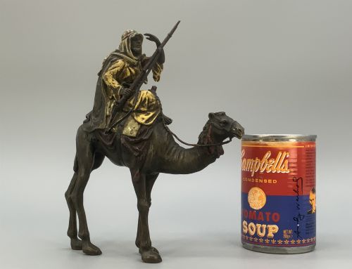 fig 2. An Austrian cold-painted bronze sculpture depicting a turbaned Arab rider holding a rifle while seated atop a standing camel.