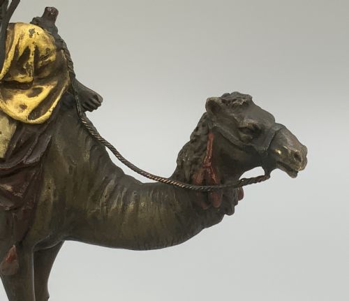 fig 4. An Austrian cold-painted bronze sculpture depicting a turbaned Arab rider holding a rifle while seated atop a standing camel.