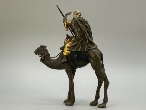 fig 8. An Austrian cold-painted bronze sculpture depicting a turbaned Arab rider holding a rifle while seated atop a standing camel.