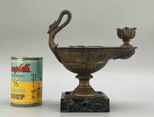 fig 5. A nineteenth-century Grand Tour patinated bronze oil lamp featuring a serpent handle and gadrooned body, mounted on a square green marble base.