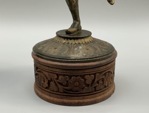 fig 8. A pair of 19th-century polychrome spelter figural candlesticks depicting male and female torchbearer figures raised on carved wooden bases.