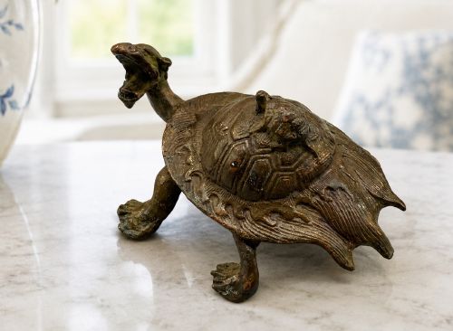 fig 1. A small Japanese Meiji period bronze sculpture of a minogame turtle with a smaller turtle perched on its shell.