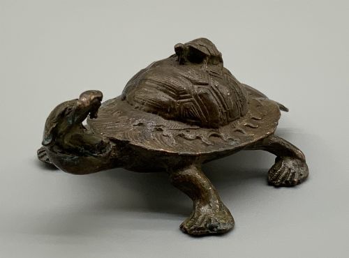 fig 4. A small Japanese Meiji period bronze sculpture of a minogame turtle with a smaller turtle perched on its shell.
