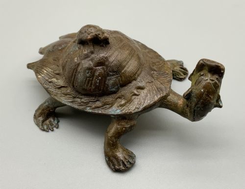 fig 7. A small Japanese Meiji period bronze sculpture of a minogame turtle with a smaller turtle perched on its shell.