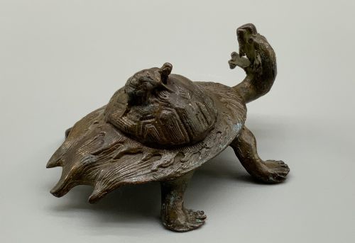 fig 8. A small Japanese Meiji period bronze sculpture of a minogame turtle with a smaller turtle perched on its shell.