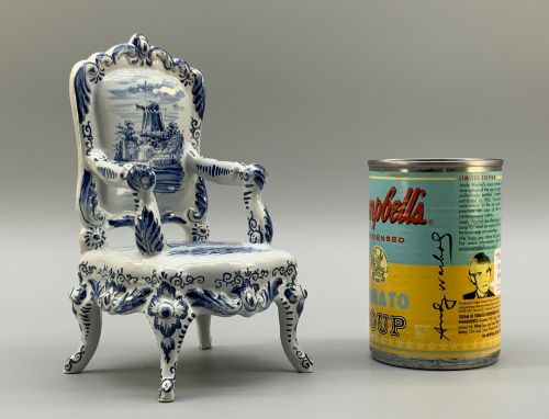 fig 2. A late 19th-century miniature porcelain armchair glazed in white and hand-painted with blue Dutch landscape scenes featuring a windmill.
