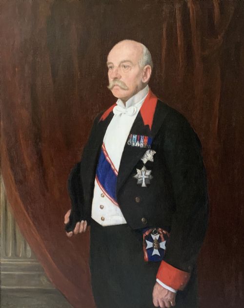 fig 2. An Edwardian portrait painting of a military officer wearing decorations and set within a carved gold frame.