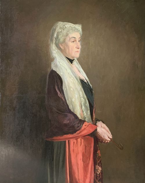 fig 1. A monumental Edwardian oil portrait on canvas depicting a seated woman in classical attire, framed in an ornate carved gold giltwood frame.