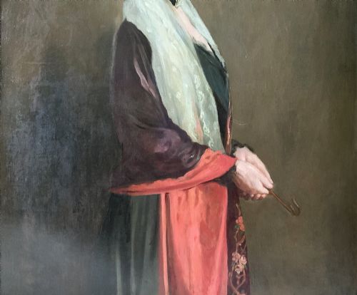 fig 5. A monumental Edwardian oil portrait on canvas depicting a seated woman in classical attire, framed in an ornate carved gold giltwood frame.