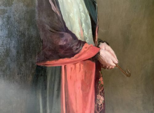fig 6. A monumental Edwardian oil portrait on canvas depicting a seated woman in classical attire, framed in an ornate carved gold giltwood frame.