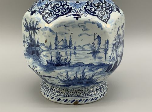 fig 10. An eighteenth-century blue and white Dutch Delftware ceramic jug decorated with hand-painted figures, complete with a fitted pewter lid.