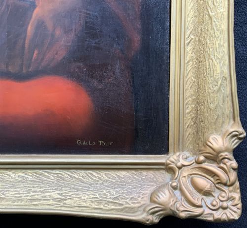 fig 10. A framed twentieth-century oil painting depicting two women in dramatic candlelight illumination leaning over a swaddled infant inside an ornate gold frame.
