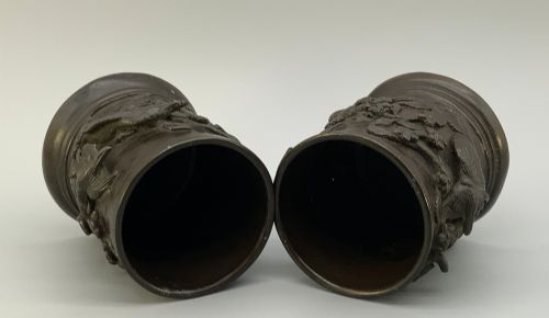 fig 8. A pair of cylindrical dark patinated bronze vases featuring raised relief depictions of birds perched amongst cherry blossom branches.