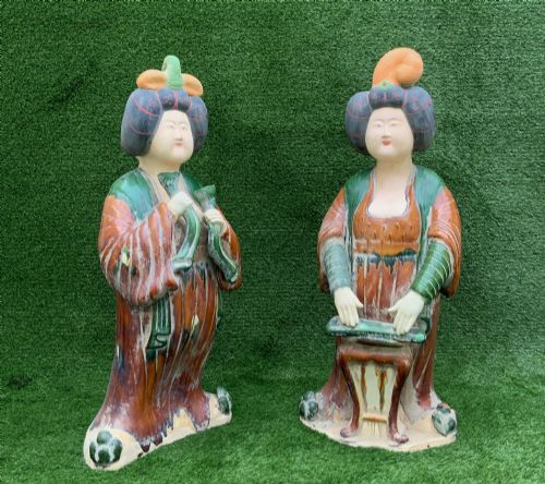 fig 2. A pair of standing terracotta female musician figures in Tang Dynasty style, finished with amber, green, and cream Sancai lead glazes.