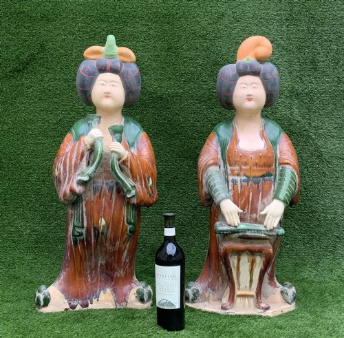 fig 3. A pair of standing terracotta female musician figures in Tang Dynasty style, finished with amber, green, and cream Sancai lead glazes.