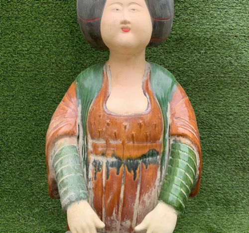 fig 8. A pair of standing terracotta female musician figures in Tang Dynasty style, finished with amber, green, and cream Sancai lead glazes.