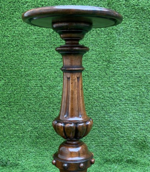 fig 5. A 19th-century Dutch marquetry wine table featuring a circular floral-inlaid top, a carved central column, and a shaped triform base raised on bun feet.