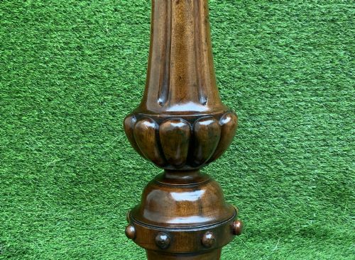 fig 8. A 19th-century Dutch marquetry wine table featuring a circular floral-inlaid top, a carved central column, and a shaped triform base raised on bun feet.