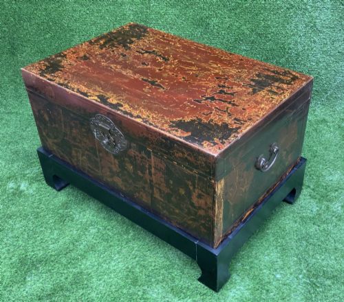 fig 1. A large rectangular Japanese lacquered storage chest with gilt figurative Chinoiserie scenes set upon a black painted wooden stand.