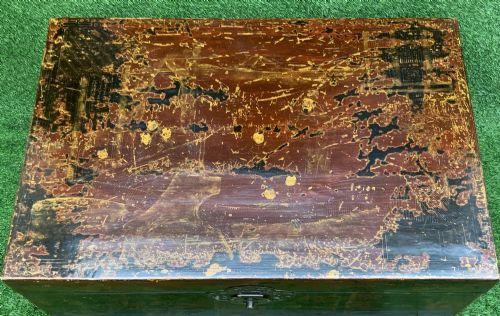 fig 3. A large rectangular Japanese lacquered storage chest with gilt figurative Chinoiserie scenes set upon a black painted wooden stand.
