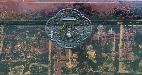 fig 4. A large rectangular Japanese lacquered storage chest with gilt figurative Chinoiserie scenes set upon a black painted wooden stand.