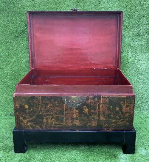 fig 6. A large rectangular Japanese lacquered storage chest with gilt figurative Chinoiserie scenes set upon a black painted wooden stand.