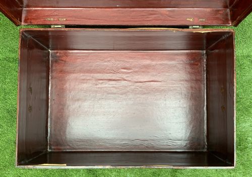 fig 7. A large rectangular Japanese lacquered storage chest with gilt figurative Chinoiserie scenes set upon a black painted wooden stand.