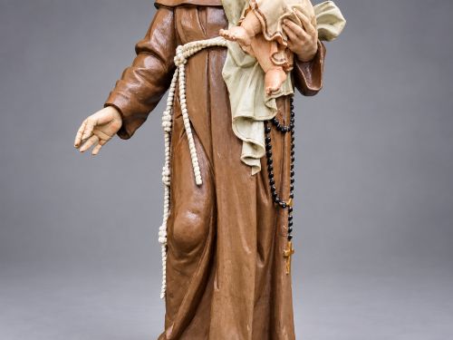 fig 6. An antique polychrome carved wood sculpture depicting Saint Anthony in a brown Franciscan habit holding the Christ Child.