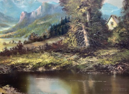 fig 6. An original alpine landscape oil painting depicting mountains, rural cottages, and a pond reflection, set within an ornate gilded frame.