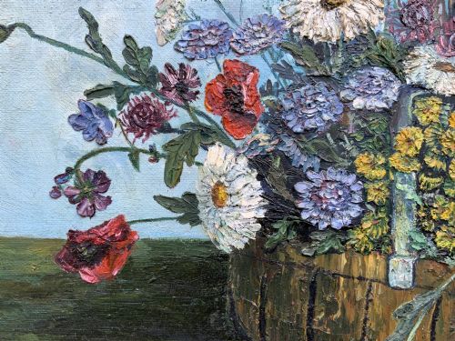 fig 7. A framed floral still life oil painting depicting a woven basket filled with colourful wildflowers including poppies and daisies against a light blue backdrop.