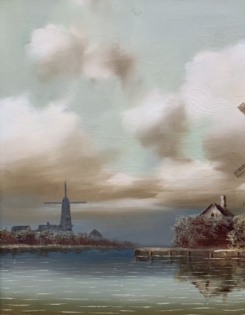 fig 3. A horizontal oil painting depicting Dutch windmills and stone buildings along a riverbank under a cloudy sky, presented in an ornate gilt frame.