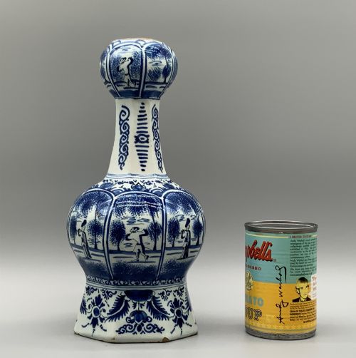 fig 3. A 17th-century hexagonal Dutch Delft blue and white faience vase decorated with hand-painted chinoiserie figures and floral motifs.