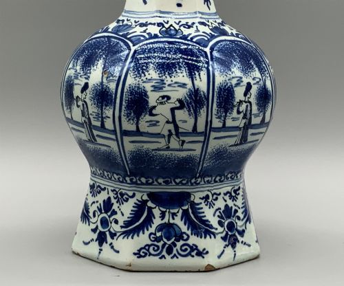 fig 6. A 17th-century hexagonal Dutch Delft blue and white faience vase decorated with hand-painted chinoiserie figures and floral motifs.