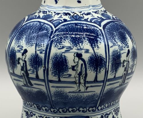 fig 9. A 17th-century hexagonal Dutch Delft blue and white faience vase decorated with hand-painted chinoiserie figures and floral motifs.