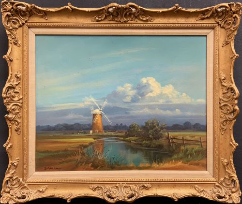 fig 1. An oil painting depicting Horsey Mill set amidst the Norfolk Broads under a cloud-filled sky, presented in an elaborate gilded swept frame.