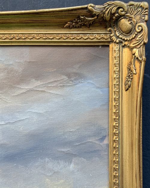 fig 8. A large framed oil painting depicting figures ice skating on a frozen canal beside historic stone buildings under a winter sky, housed in an ornate gilt frame.