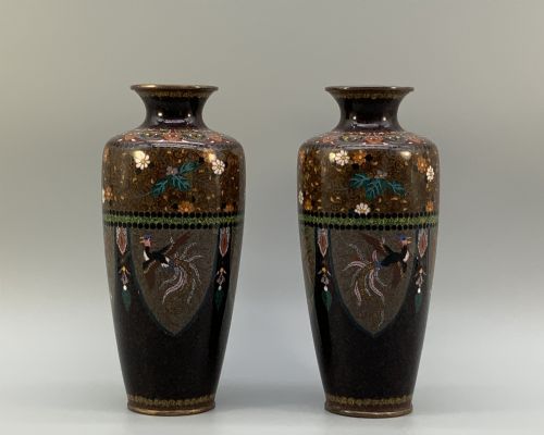 fig 1. A pair of Japanese Meiji period cloisonne enamel vases featuring detailed phoenix birds, floral motifs, and geometric borders on a dark background.