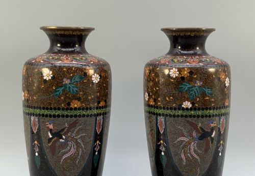 fig 3. A pair of Japanese Meiji period cloisonne enamel vases featuring detailed phoenix birds, floral motifs, and geometric borders on a dark background.