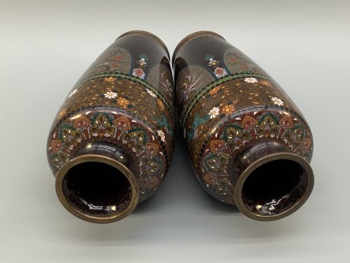 fig 8. A pair of Japanese Meiji period cloisonne enamel vases featuring detailed phoenix birds, floral motifs, and geometric borders on a dark background.