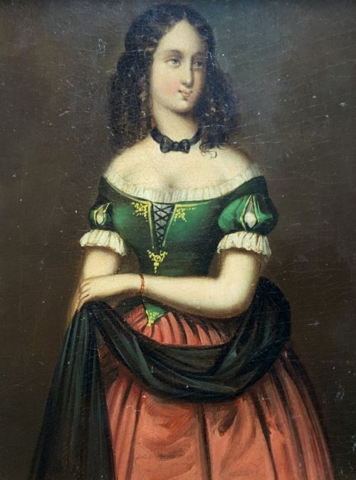 fig 1. A framed miniature oil portrait depicting a Victorian woman with dark curly hair in a green and red dress, enclosed in a gilded wooden frame with egg-and-dart detail.