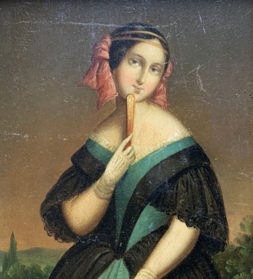 fig 2. A framed 19th-century miniature oil painting depicting a seated woman in a teal dress and dark shawl holding a fan.