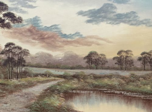 fig 2. A twentieth-century framed oil painting depicting a countryside path alongside a reflective pond, surrounded by tall trees and distant hills under a clouded sky.