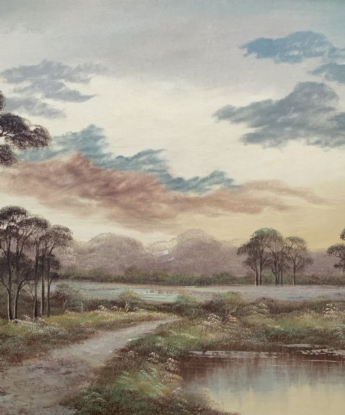 fig 4. A twentieth-century framed oil painting depicting a countryside path alongside a reflective pond, surrounded by tall trees and distant hills under a clouded sky.