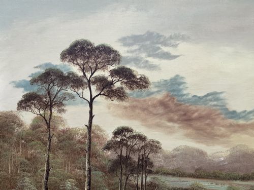 fig 6. A twentieth-century framed oil painting depicting a countryside path alongside a reflective pond, surrounded by tall trees and distant hills under a clouded sky.
