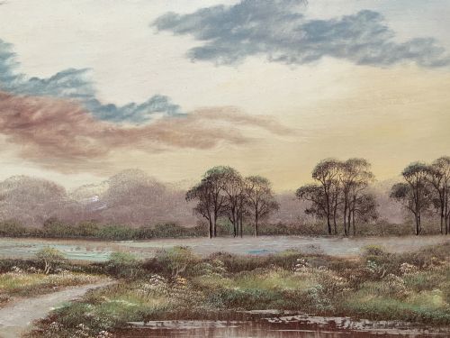 fig 7. A twentieth-century framed oil painting depicting a countryside path alongside a reflective pond, surrounded by tall trees and distant hills under a clouded sky.