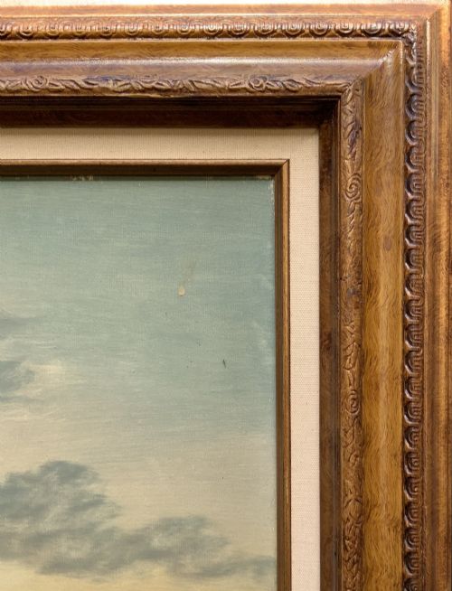 fig 8. A twentieth-century framed oil painting depicting a countryside path alongside a reflective pond, surrounded by tall trees and distant hills under a clouded sky.