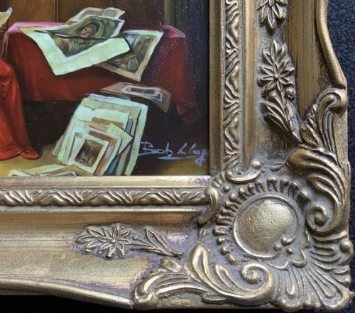 fig 7. A miniature oil painting depicting a cardinal dressed in red robes seated inside a library reading papers, set within an ornate carved gilt frame.