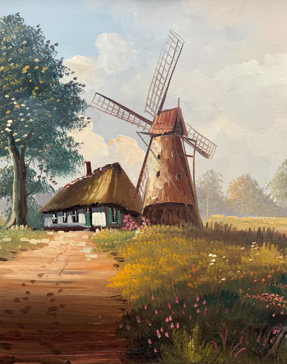 A horizontal oil painting depicting a rural Dutch scene with a tall windmill, thatched cottages, and a calm pond, framed in an ornate gilded frame. View V